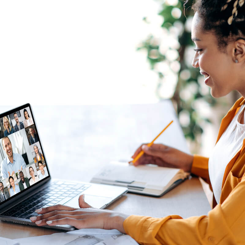 A woman attending and listeing to a live session