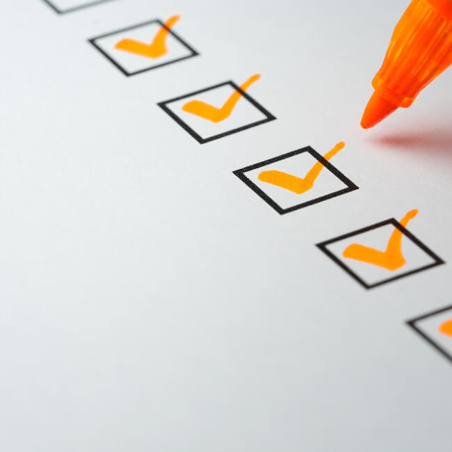 Check boxes (checked) with pen